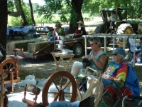 Knitters relaxing under the trees