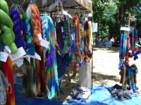 A vendors booth with roving and hand dyed yarns